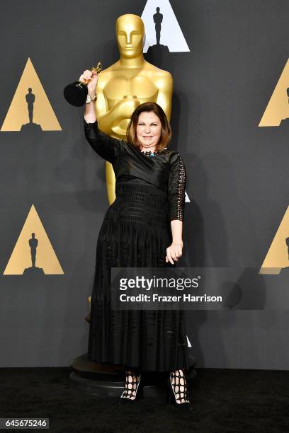 Costume Designer Colleen Atwood, winner of the Best Costume Design award for 'Fantastic Beasts and Where to Find Them' poses in the press room during...