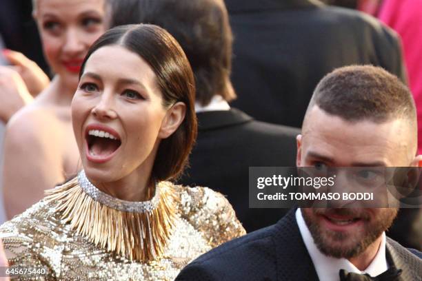 Nominee for Best Music "Can't Stop The Feeling" for Trolls Justin Timberlake and his wife US actress Jessica Biel arrive on the red carpet for the...