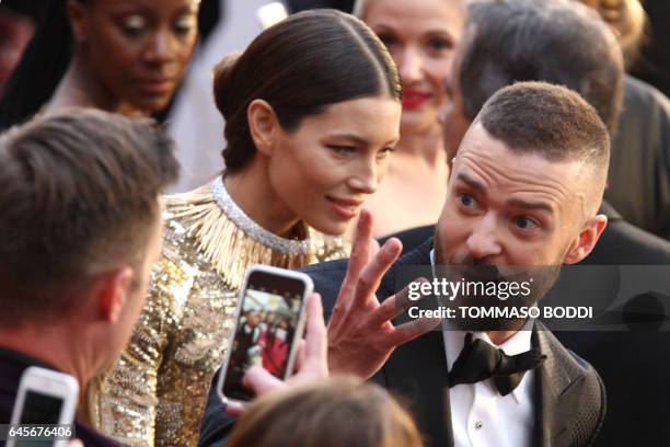 Nominee for Best Music "Can't Stop The Feeling" for Trolls Justin Timberlake and his wife US actress Jessica Biel arrive on the red carpet for the...