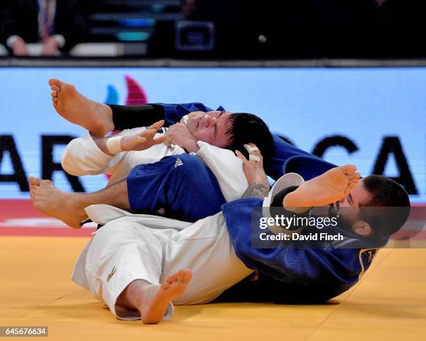 Toma Nikiforov of Belgium puts a submission hold on Aaron Wolf of Japan to win the u100kg final and the gold medal during the 2017 Dusseldorf Grand...