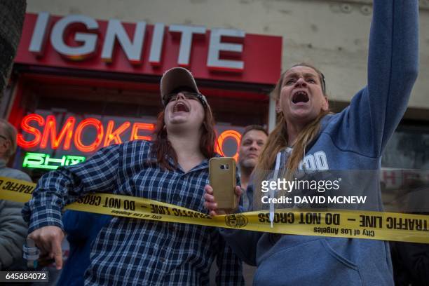 Supporters of President Donald Trump yell at people marching to protest the Dakota Access Pipeline, on Hollywood Boulevard near the site of the 89th...