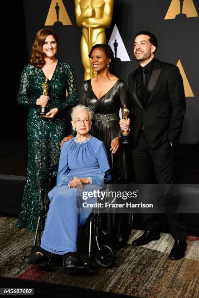 Mathematician Katherine Johnson and director Ezra Edelman and producer Caroline Waterlow , winners of Best Documentary Feature for 'O.J.: Made in...