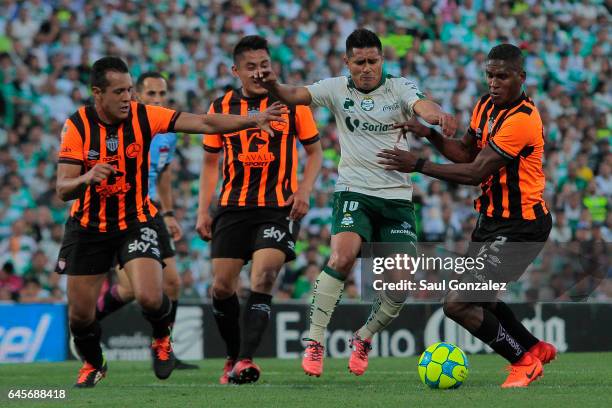 Osvaldo Martinez of Santos and Brayan Beckeles of Necaxa fight for the ball during the 8th round match between Santos Laguna and Necaxa as part of...