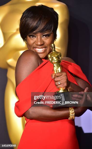 Actress Viola Davis poses with the Oscar for Best Actress in a Supporting Role in the press room, during the 89th Oscars on February 26 in Hollywood,...