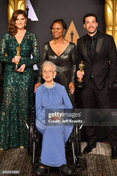 Producer Caroline Waterlow and director/producer Ezra Edelman , winners of the award for Documentary for 'O.J.: Made in America,' pose with physicist...