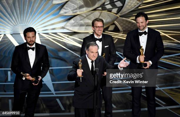 Visual effects artists Robert Legato and Adam Valdez, Andrew R. Jones, and Dan Lemmon accept Best Visual Effects for 'The Jungle Book' onstage during...
