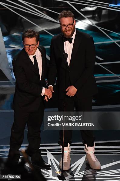 Michael Rogen US actor Michael J. Fox and Canadian actor Seth Rogen arrive on stage ...