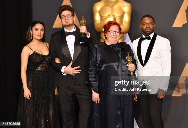 Presenter Salma Hayek, filmmaker Kristof Deak and producer Anna Udvardy, winners of the Best Live Action Short Film 'Sing', and presenter David...