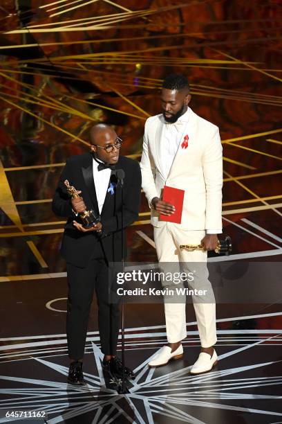 Writer/director Barry Jenkins and writer Tarell Alvin McCraney accept Best Adapted Screenplay for 'Moonlight' onstage during the 89th Annual Academy...