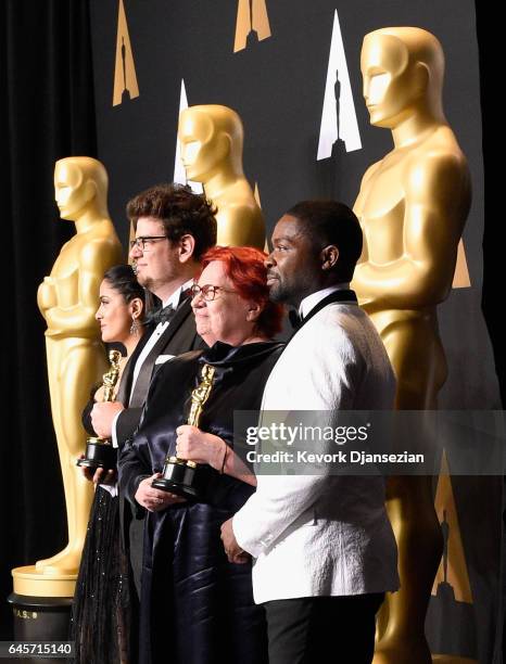 Producer Anna Udvardy and director Kristof Deak , winners of the award for Short Film for 'Sing,' pose with presenters Salma Hayek and David Oyelowo...