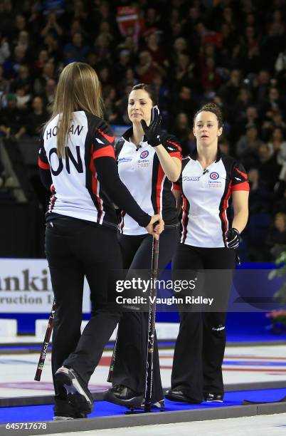 Rachel Homan of Ontario celebrates a shot with Lisa Weagle and Joanne Courtney in the Gold Medal match against Manitoba during the 2017 Scotties...