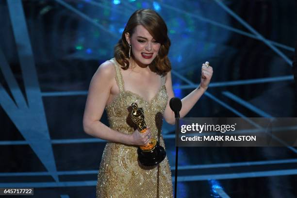 Actress Emma Stone delivers a speech on stage after she won the Best Actress award in "La La Land" at the 89th Oscars on February 26, 2017 in...