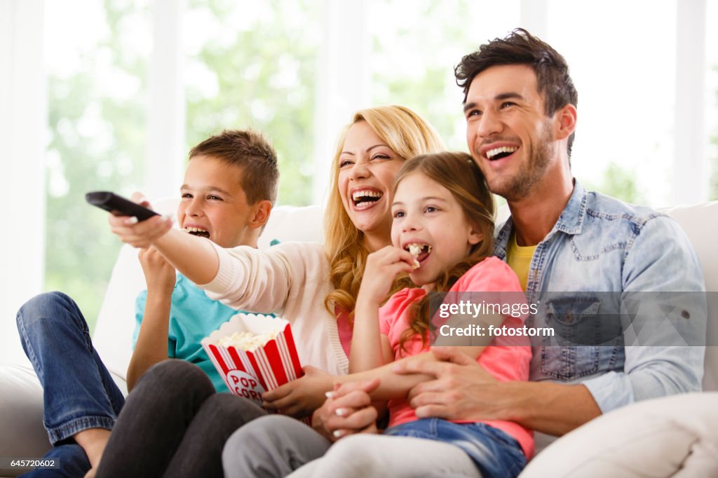 Family watching funny movie together