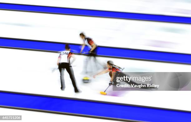 Emma Miskew of Ontario delivers a stone as Joanne Courtney and Lisa Weagle sweep in the Gold Medal match against Manitoba during the 2017 Scotties...