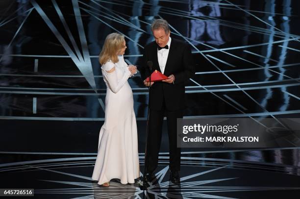 Actress Faye Dunaway and actor Warren Beatty arrive on stage to announce the winner of the Best Movie category at the 89th Oscars on February 26,...