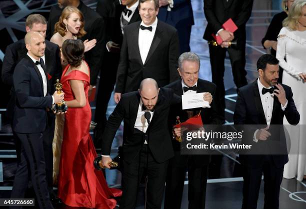 La La Land' producer Jordan Horowitz holds up the winner card reading actual Best Picture winner 'Moonlight' with actor Warren Beatty and host Jimmy...