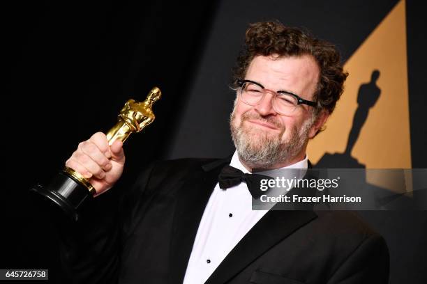 Writer/director Kenneth Lonergan, winner of the Best Original Screenplay award for 'Manchester by the Sea' poses in the press room during the 89th...