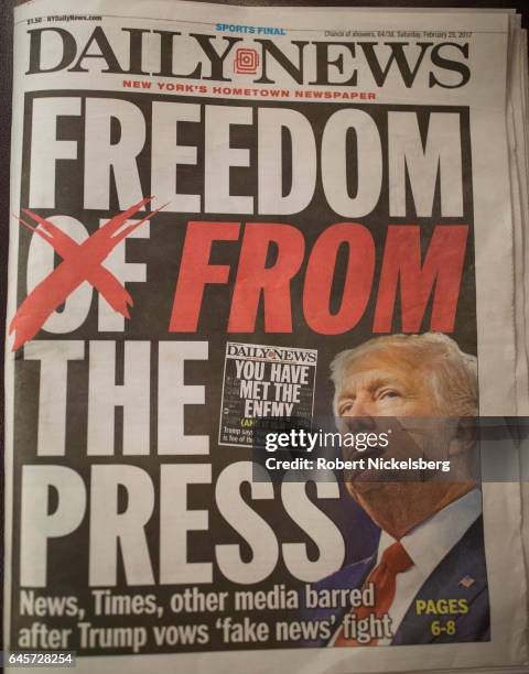 The front page of the New York Daily News carries a picture of President Donald Trump February 25, 2017 a day after he criticized in a speech the FBI...