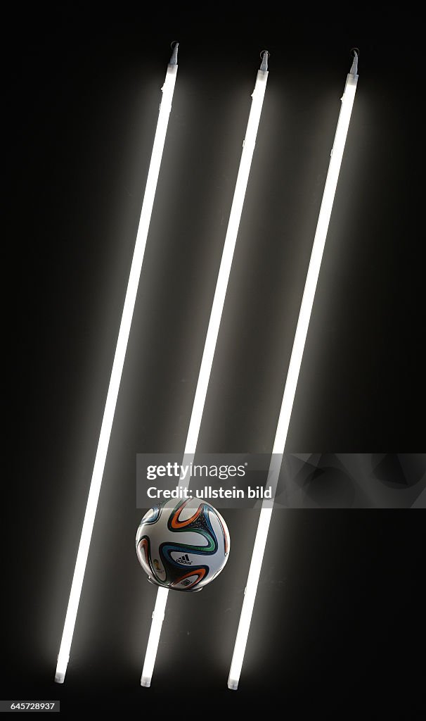 Three neon lights with ball by adidas