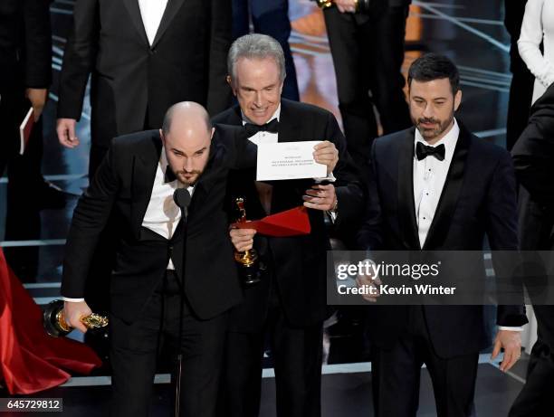 La La Land' producer Jordan Horowitz holds up the winner card reading actual Best Picture winner 'Moonlight' with actor Warren Beatty and host Jimmy...