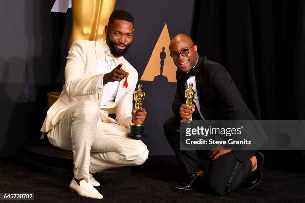 Screenwriter Tarell Alvin McCraney and filmmaker Barry Jenkins, winners of the award for Adapted Screenplay for 'Moonlight,' pose in the press room...
