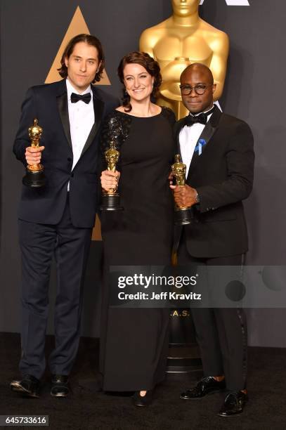 Producers Jeremy Kleiner, Adele Romanski, and director Barry Jenkins, winners of the Best Picture award for "Moonlight," pose in the press room...