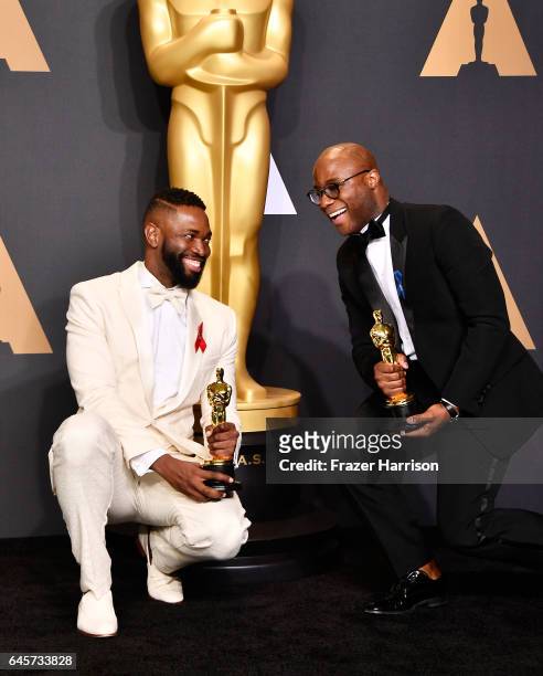 Screenwriter Tarell Alvin McCraney and writer/director Barry Jenkins, winners of Best Adapted Screenplay for 'Moonlight', pose in the press room...