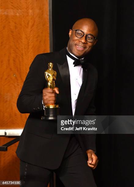 Writer/director Barry Jenkins, winner of the Best Adapted Screenplay for 'Moonlight,' poses in the press room during the 89th Annual Academy Awards...