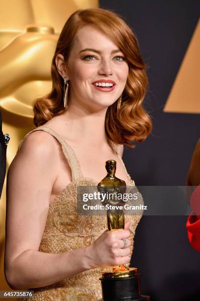 Actor Emma Stone, winner of the award for Actress in a Leading Role for 'La La Land,' poses in the press room during the 89th Annual Academy Awards...