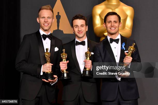 Composers Justin Paul, Justin Hurwitz and Benj Pasek, winners of the award for Music for 'City of Stars' from 'La La Land,' poses in the press room...