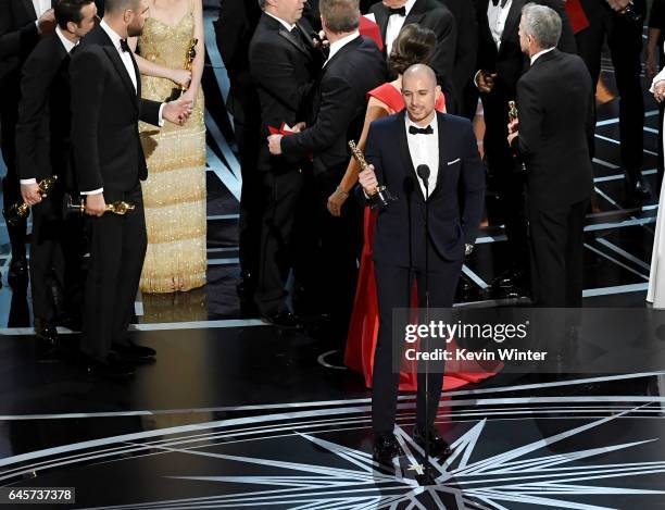 La La Land' producer Fred Berger speaks at the microphone as production staff and representatives from PricewaterhouseCoopers, Martha L. Ruiz and...