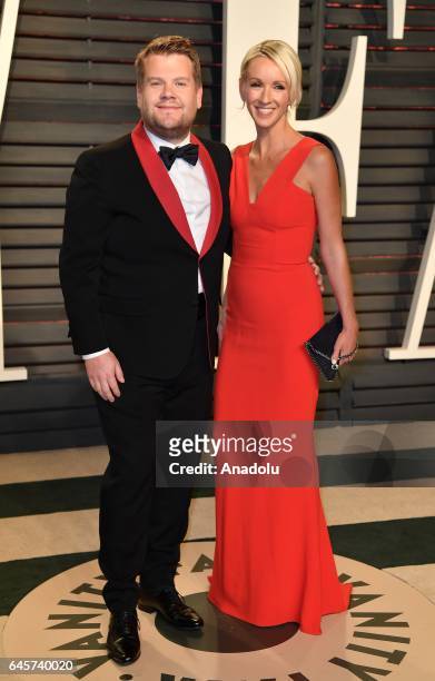 James Corden and Julia Carey pose as they arrive at the Vanity Fair Oscar Party in Beverly Hills, California, Los Angeles on February 26, 2017.