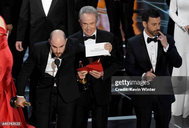 La La Land' producer Jordan Horowitz holds up the winner card reading actual Best Picture winner 'Moonlight' after a presentation error with actor...
