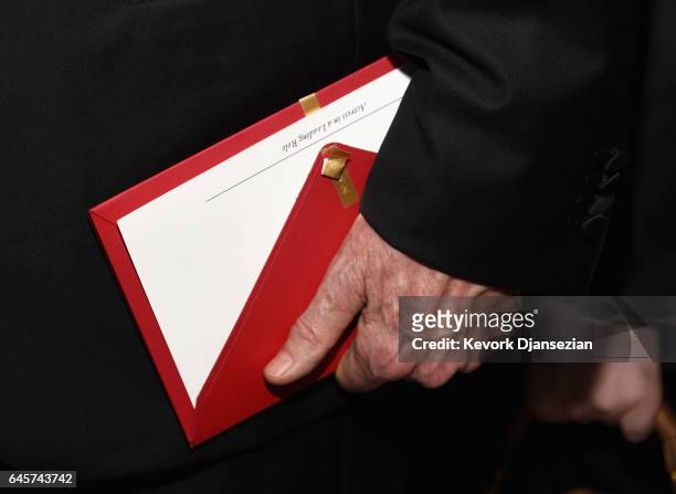 Actor/filmmaker Warren Beatty holds the envelope containing the wrong award announcement for Best Picture during the 89th Annual Academy Awards...