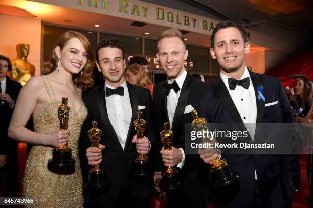 Actor Emma Stone, winner of the award for Actress in a Leading Role for 'La La Land,' and composers Justin Hurwitz, Justin Paul and Benj Pasek,...