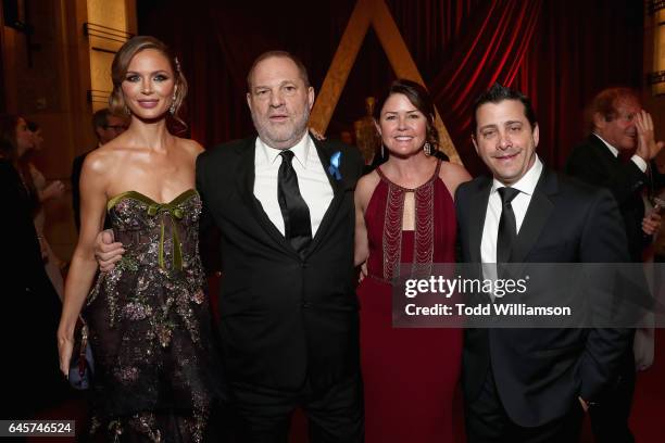 Designer Georgina Chapman, Producer Harvey Weinstein, COO of The Weinstein Company David Glasser and Michele Glasser attend the 89th Annual Academy...