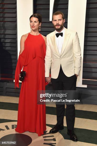 Actors Amelia Warner and Jamie Dornan attend the 2017 Vanity Fair Oscar Party hosted by Graydon Carter at Wallis Annenberg Center for the Performing...