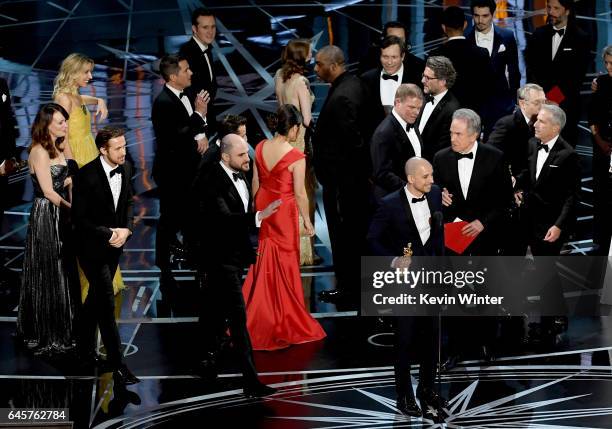 La La Land' producer Jordan Horowitz speaks while holding an Oscar and the winner card before reading the actual Best Picture winner 'Moonlight'...