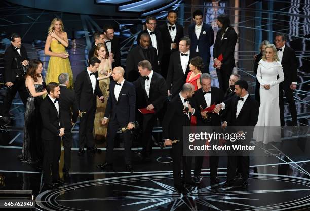 La La Land' producer Jordan Horowitz speaks while holding an Oscar and the winner card before reading the actual Best Picture winner 'Moonlight'...