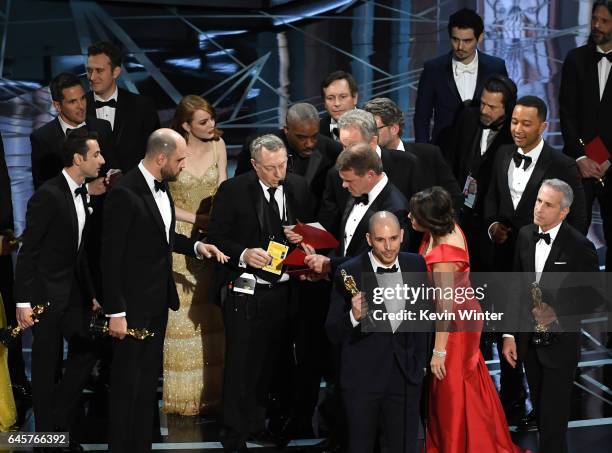 La La Land' producer Fred Berger speaks at the microphone as production staff and representatives from PricewaterhouseCoopers, Martha L. Ruiz and...