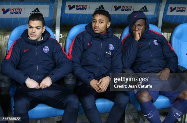 Hatem Ben Arfa, Christopher Nkunku, Serge Aurier of PSG seat on the bench during the French Ligue 1 match between Olympique de Marseille and Paris...