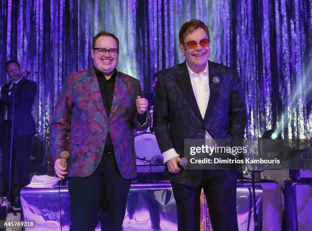 Recording artist Paul Janeway and Sir Elton John perform onstage at the 25th Annual Elton John AIDS Foundation's Academy Awards Viewing Party at The...