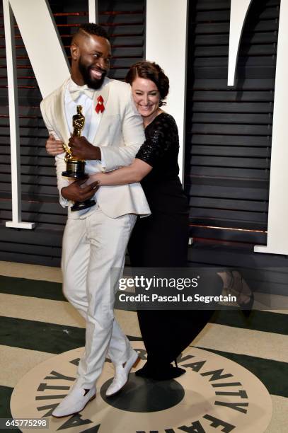 Writer Tarell Alvin McCraney and producer Adele Romanski attend the 2017 Vanity Fair Oscar Party hosted by Graydon Carter at Wallis Annenberg Center...