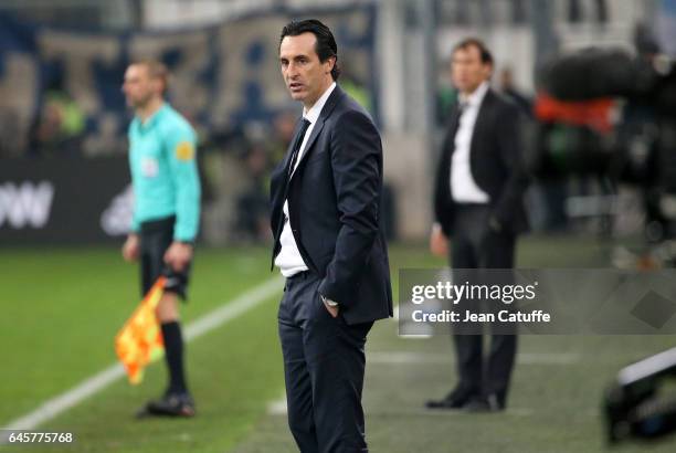 Coach of PSG Unai Emery and coach of OM Rudi Garcia look on during the French Ligue 1 match between Olympique de Marseille and Paris Saint Germain at...