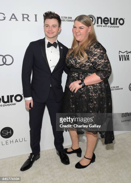Actors Chris Colfer and Ashley Fink attend the 25th Annual Elton John AIDS Foundation's Academy Awards Viewing Party with cocktails by Clase Azul...