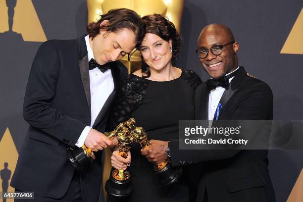 Jeremy Kleiner, Adele Romanski and Barry Jenkins attend the 89th Annual Academy Awards - Press Room at Hollywood & Highland Center on February 26,...