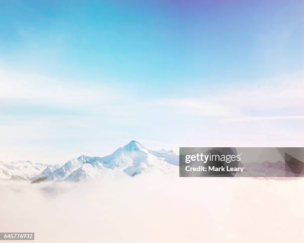 mist drifting between the austrian mountain range of mayrhofen - summit stock pictures, royalty-free photos & images