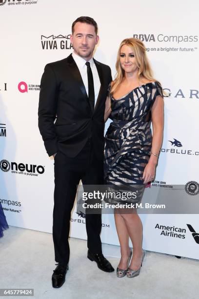 Actor Barry Sloane and Katy O'Grady attend the 25th Annual Elton John AIDS Foundation's Academy Awards Viewing Party at The City of West Hollywood...