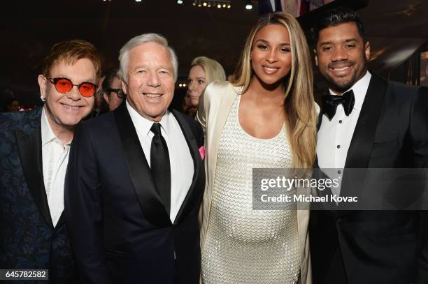 Host Sir Elton John, CEO of the New England Patriots Robert Kraft, singer Ciara and football player Russell Wilson attend the 25th Annual Elton John...