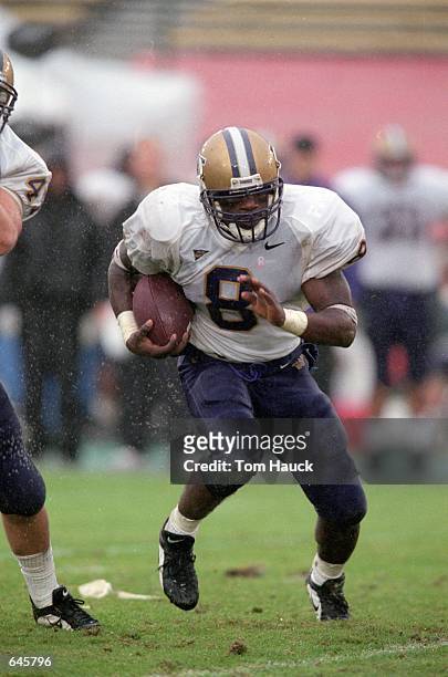 Willie Hurst of the Washington Huskies moves with the ball during the game against the Stanford Cardinal at Palo Alto, California. The Huskies...
